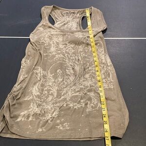 Super cute tank top with shiny metal on the front razorback.